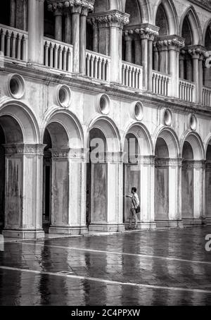 Venice, Italy – May 20, 2017: Doge`s Palace or Palazzo Ducale in black and white. It is famous tourist attraction of Venice. Old facade of the Doge`s Stock Photo